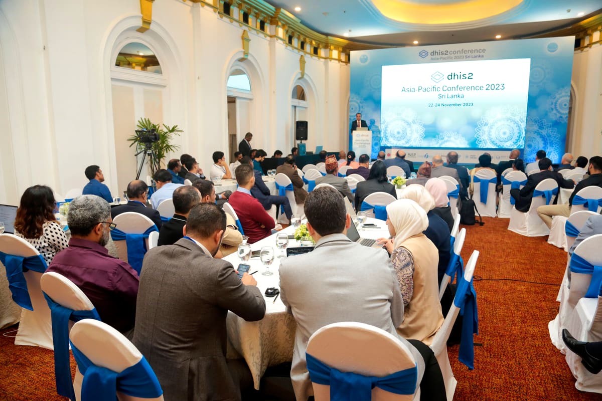 Wide view of a full conference ballroom facing the Asia-Pacific Conference 2023 stage