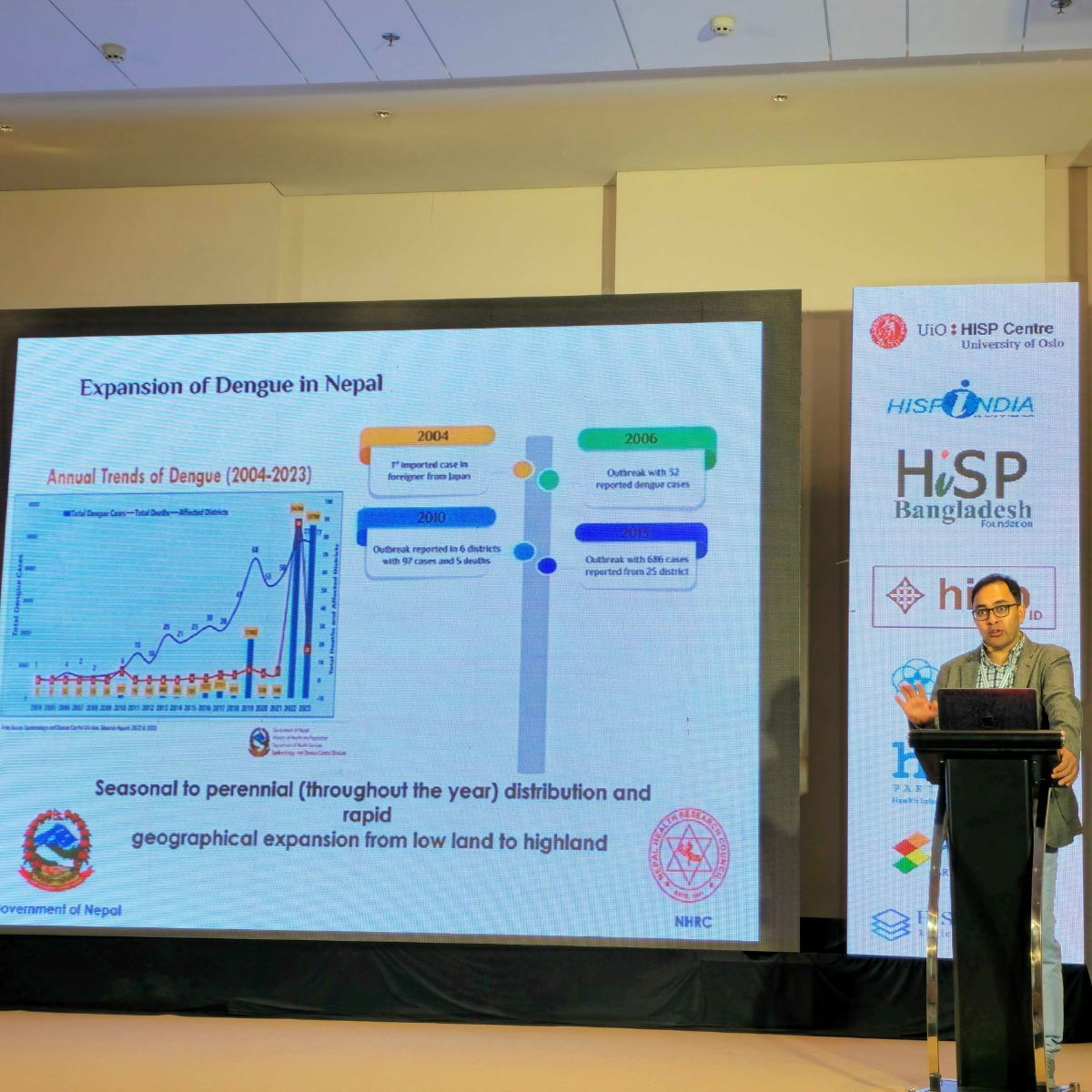 A presenter sharing a timeline of dengue expansion in Nepal at the 2024 conference